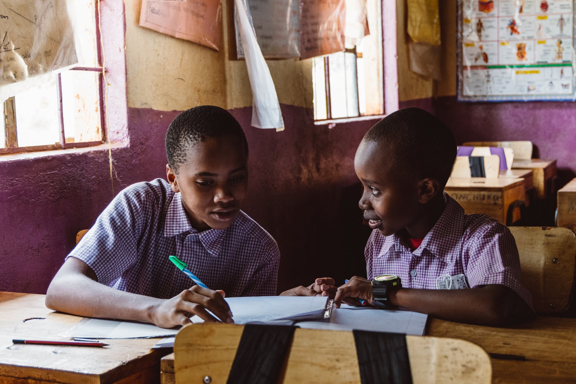boys studying together in a classroom